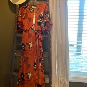 NWT Wrap dress by Love Stitch. Size small and is a burgundy/burnt orange color.